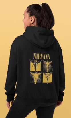 Person wearing a black hoodie with Nirvana logo on the back against a beige background