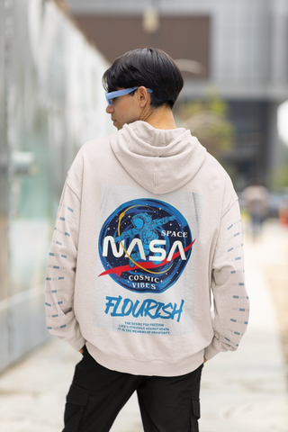 Person wearing a hoodie with NASA logo and 'Flourish' text on the back.